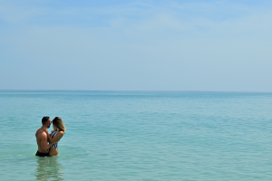 Couple embracing in ocean