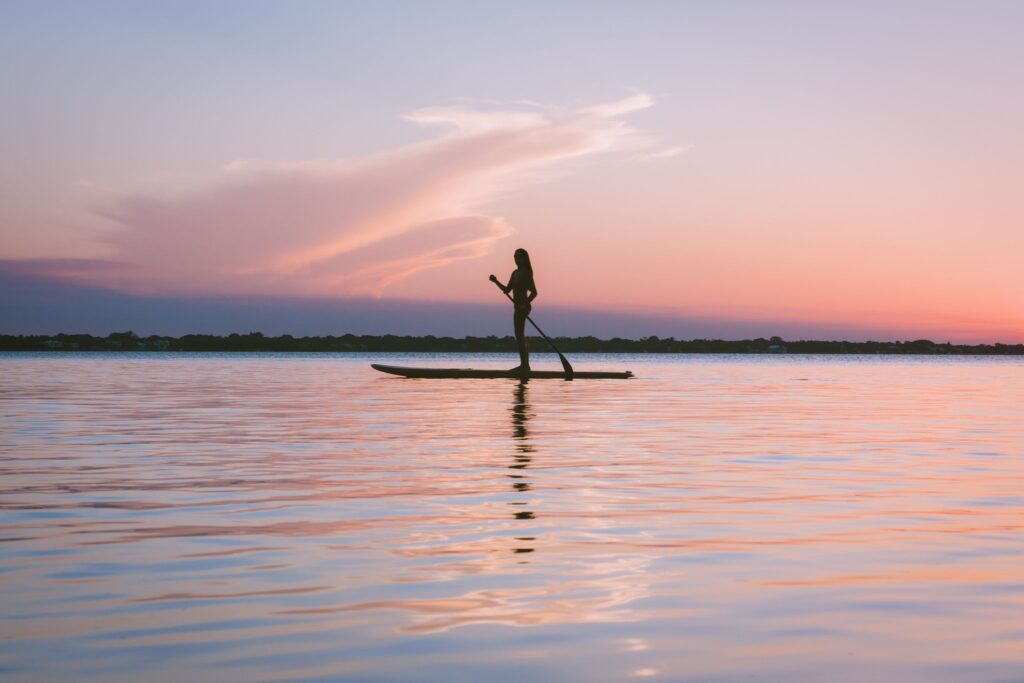 woman paddle boarding