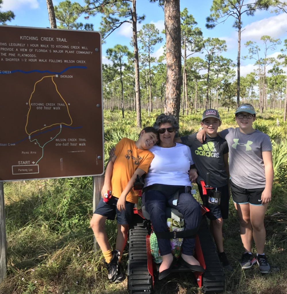 Woman explores Jonathan Dickinson State Park with park's free track chair