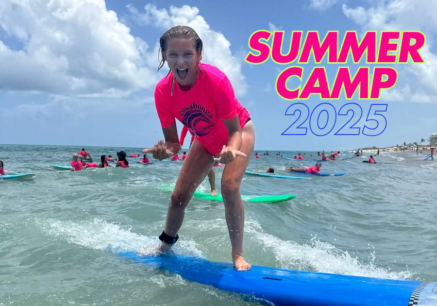 little girl surfing on the waves in pink shirt with Cowabunga Surf and Sport