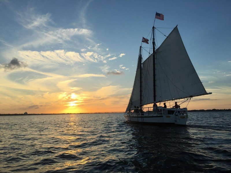 Schooner Lily departs on a sunset sail.