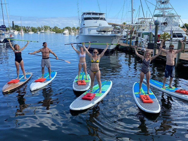 A group of stand up paddleboarders in Martin County 