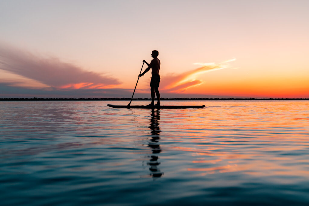 man paddle boarding