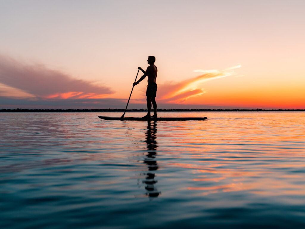man paddle boarding