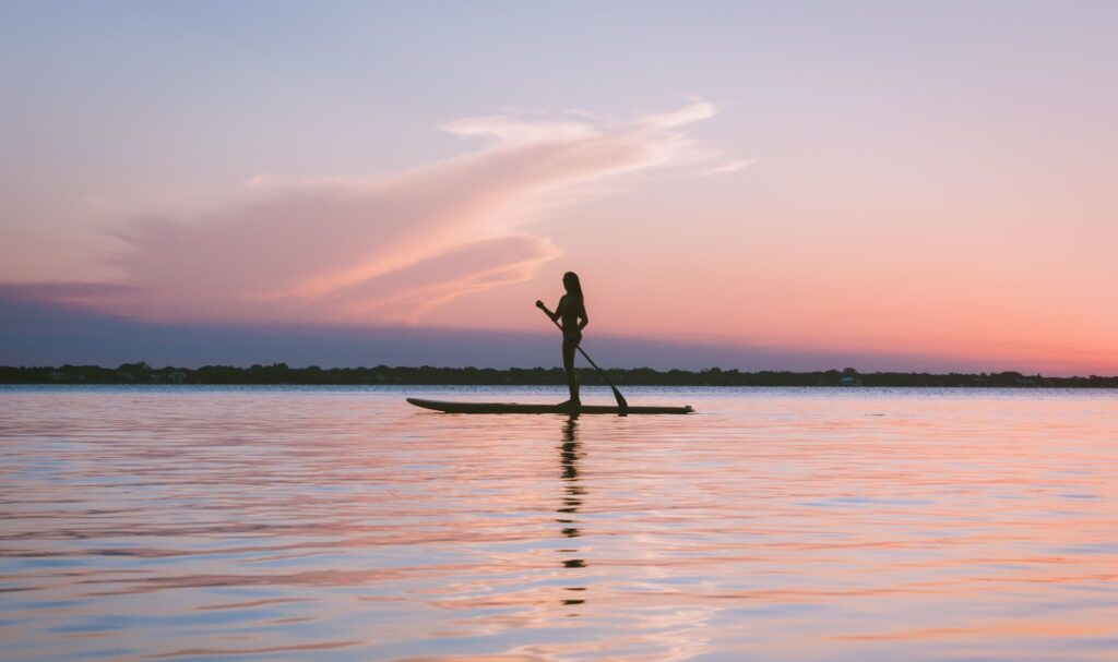 woman paddleboarding