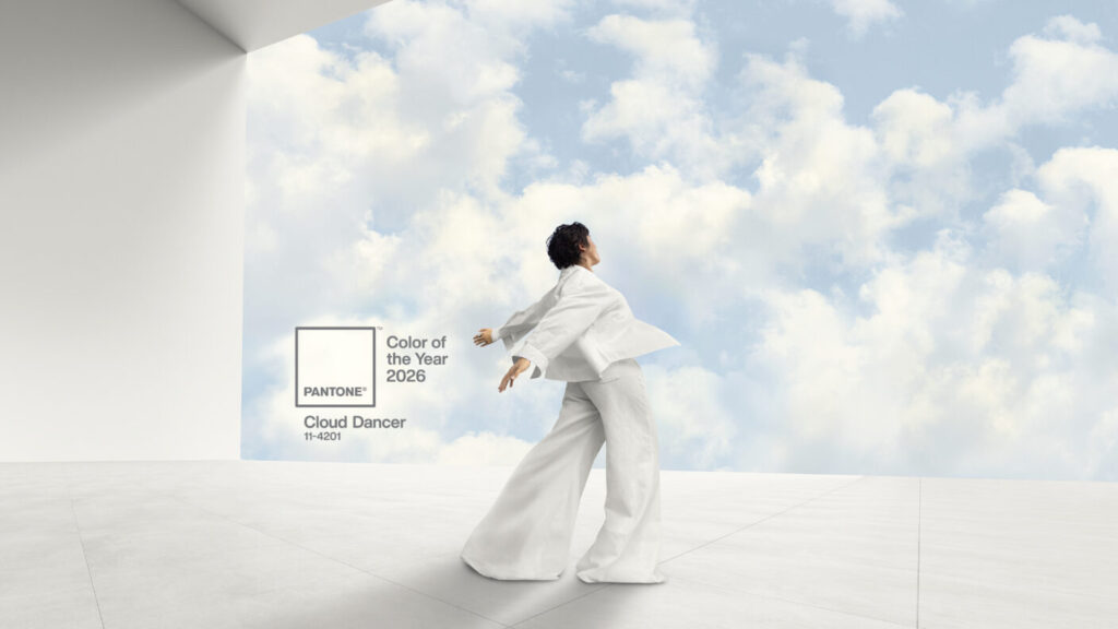 Pantone Color of the Year 2026 featuring a person in all white standing in front of clouds