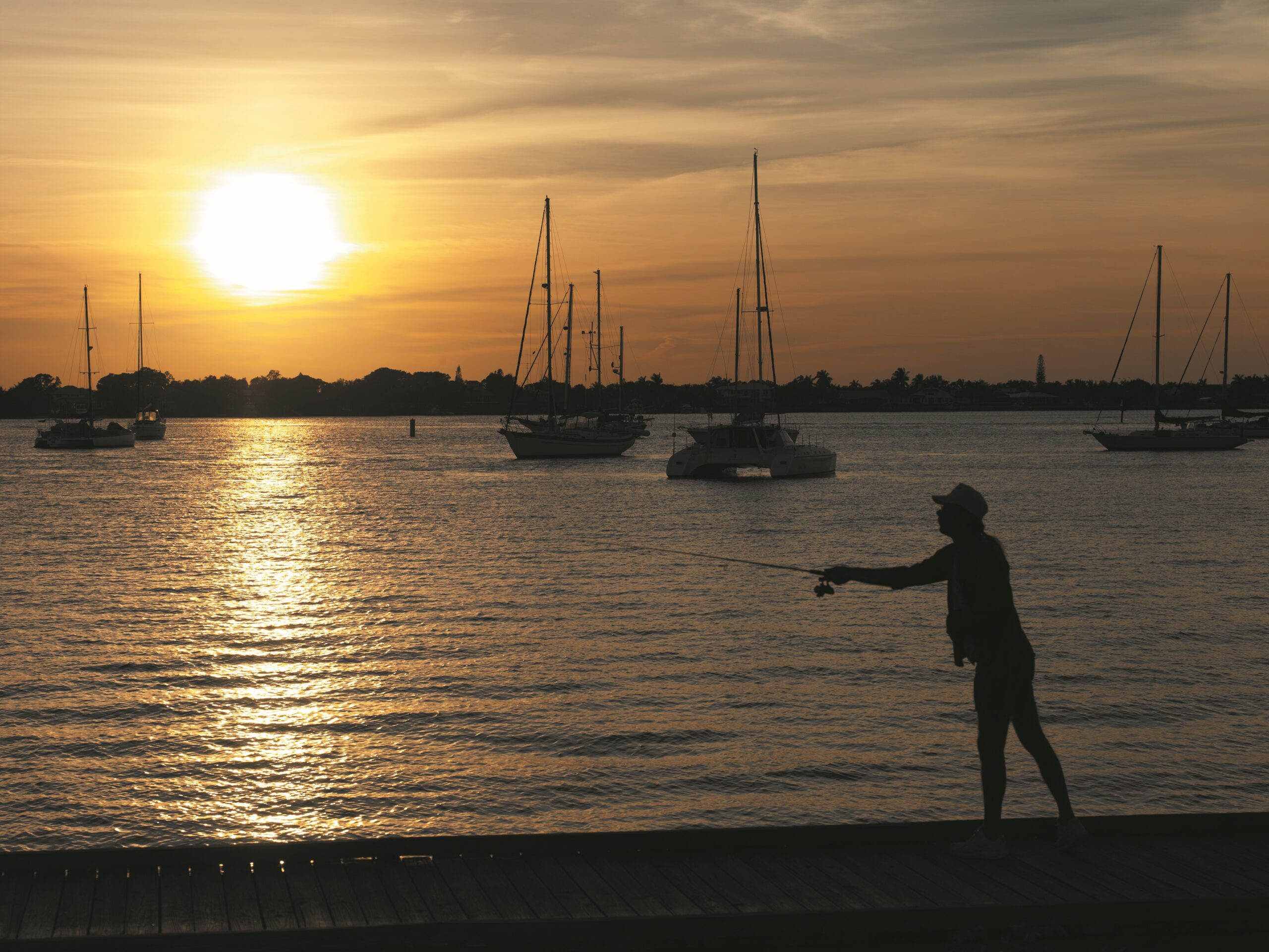 Man fishing on dock