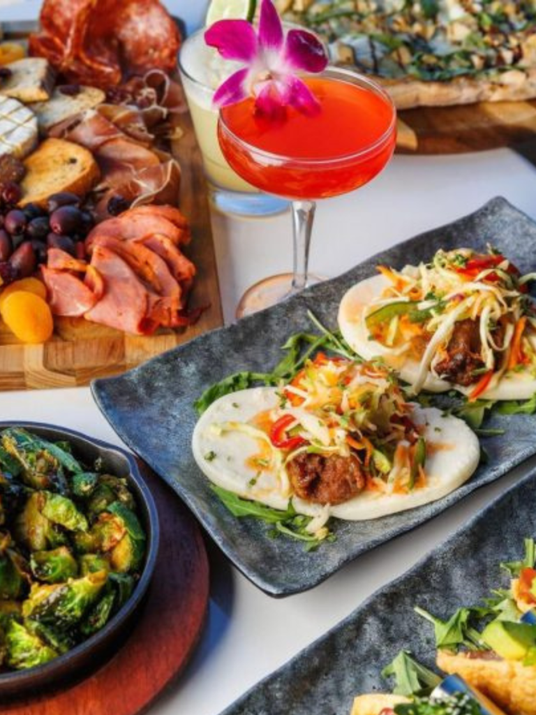 table spread of food and cocktails