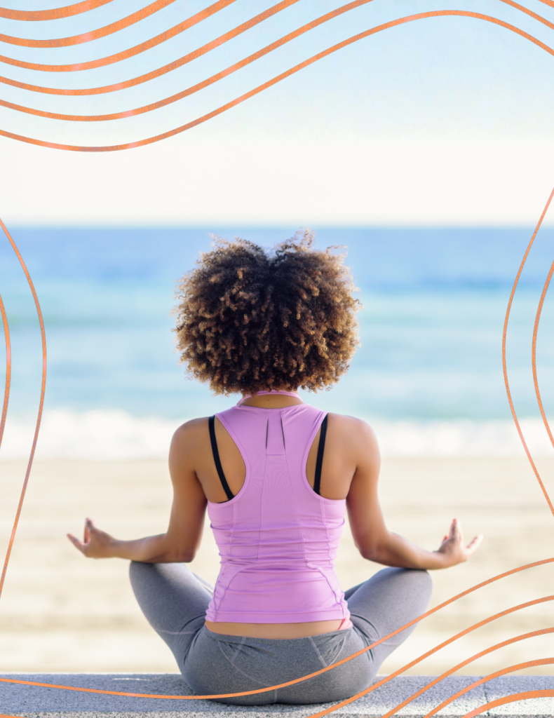 woman doing yoga on beach