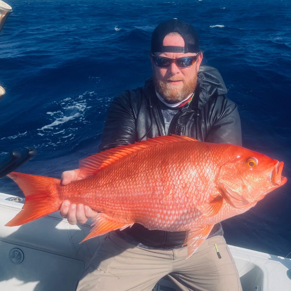 Michael McFadden holding a fish